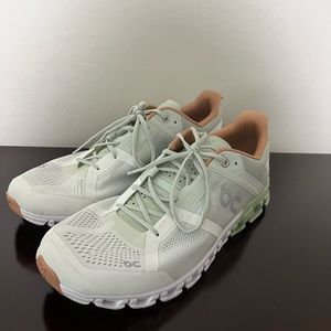 On cloud white and green sneakers
